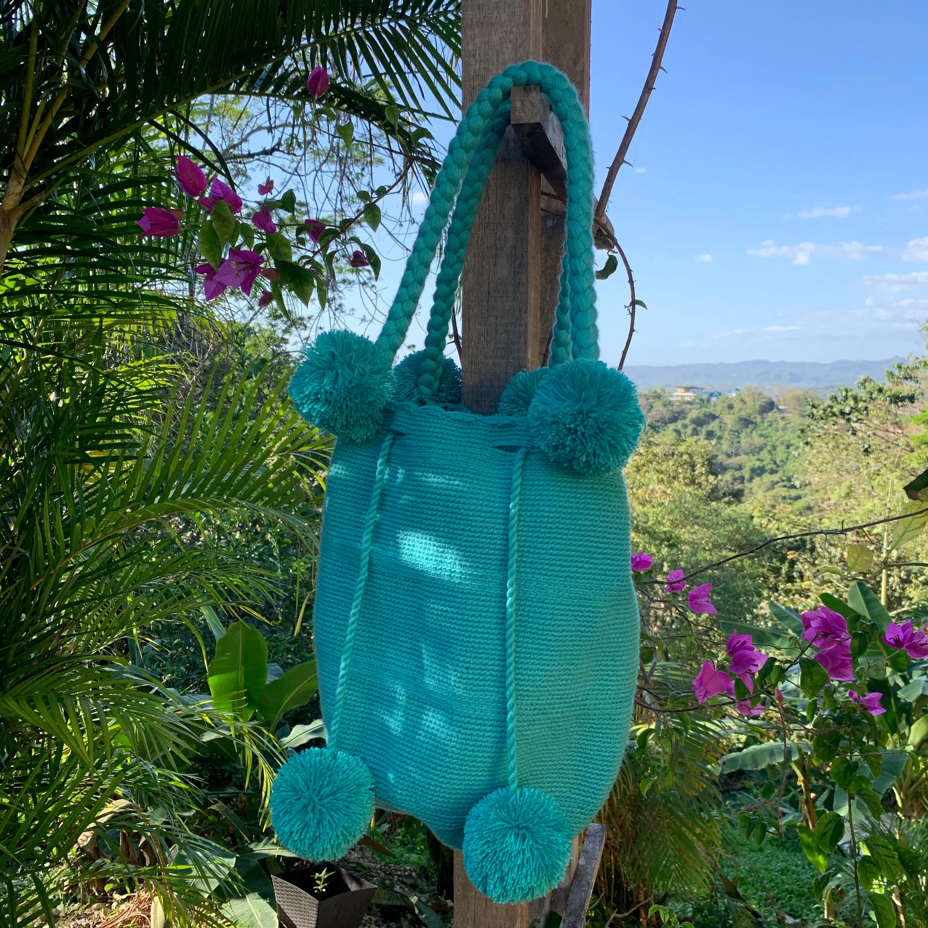 Turquoise Pom Pom Mochila